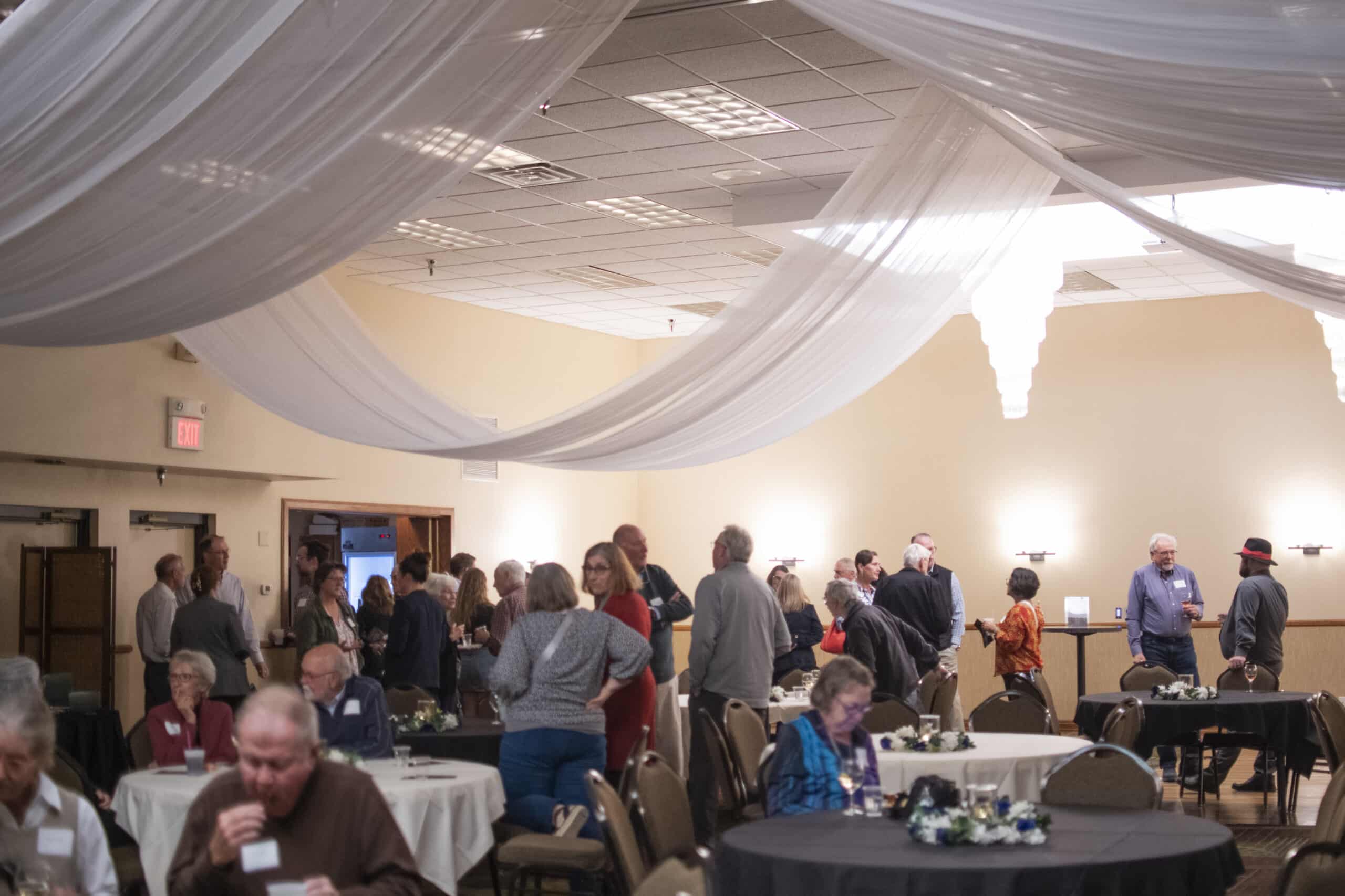 attendees standing and chatting